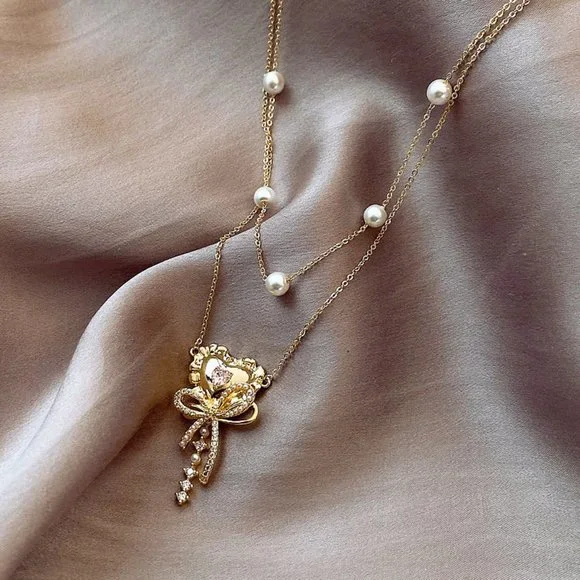 GOLICC Pearl Bow Necklace - Picture 5 of 8